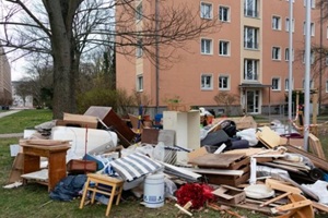house trash outside a red building in Chesapeake, VA