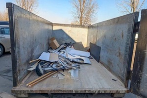 view inside an open Virginia Beach dumpster rental being filled with construction debris