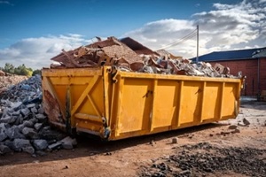 big yellow dumpster filled with construction waste