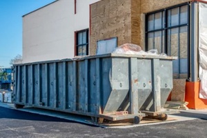 large dumpster rental outside a Virginia Beach rental home