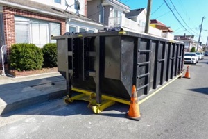 trash dumpster outside a home building