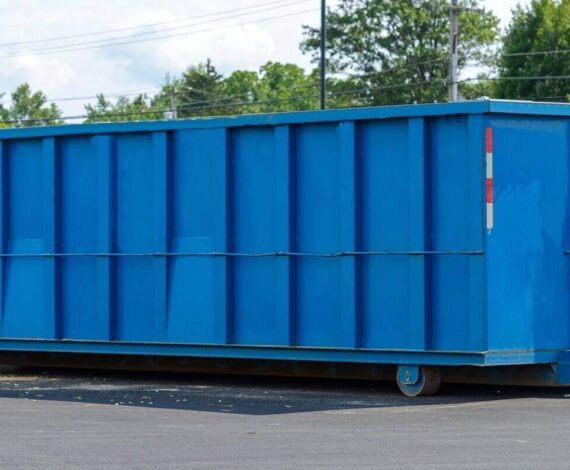 large iron dumpster garbage metal recycle in Virginia Beach, VA parking lot