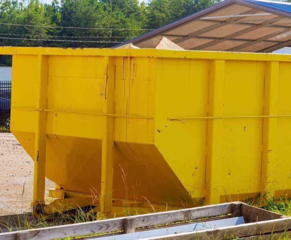 waste is stored in metal containers in dumpsters