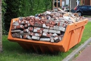 bricks in a garbage dumpster