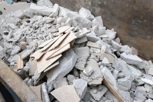 construction debris in a dumpster