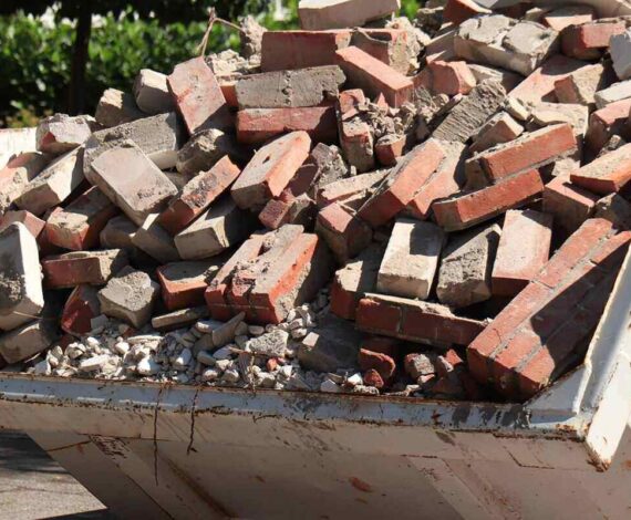 garbage dumpster near a construction site