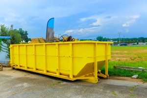 big yellow dumpster with home trash