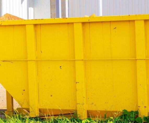 construction site with metal container dumpsters for storing waste during construction