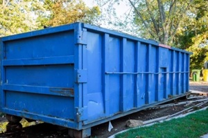 roll-off dumpster filled with building rubble
