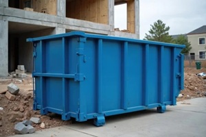 industrial skip bin sits on concrete path at construction site with unfinished building