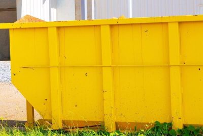 construction site with metal container dumpsters for storing waste during construction