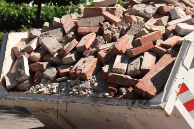 garbage dumpster near a construction site