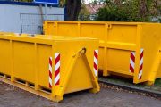 two yellow metal dumpster containers for construction garbage, house renovation